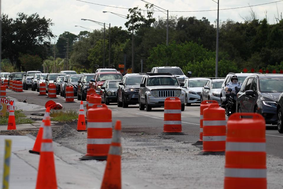 East-bound traffic along S.R. 60 begins to build, with the right lane closed, creating an issue for the BP gas station at 43rd Avenue and S.R. 60 on the other side of the traffic barricades on Friday, Sept. 10, 2014, in Indian River County. 
