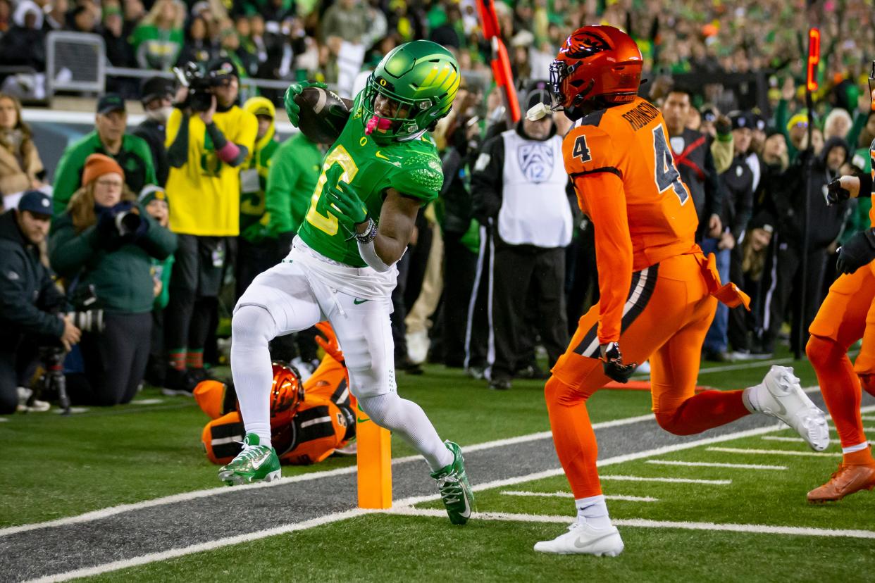 Oregon running back Bucky Irving scores a touchdown as the No. 6 Oregon Ducks take on the No. 16 Oregon State Beavers Friday, Nov. 24, 2023, at Autzen Stadium in Eugene, Ore.