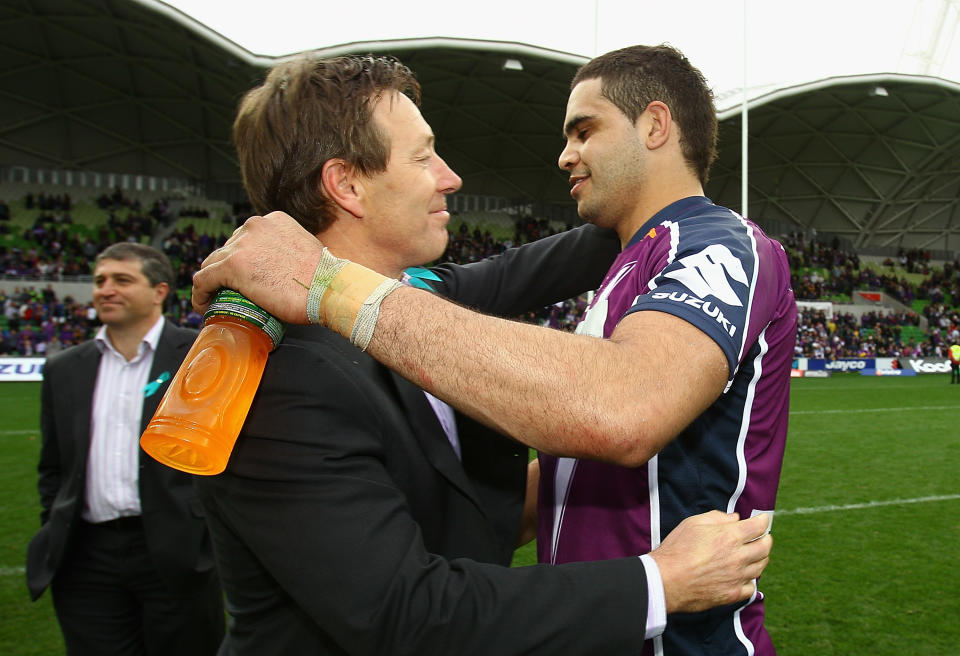 MELBOURNE, AUSTRALIA - SEPTEMBER 05:  Craig Bellamy and Greg Inglis of the Storm hug at the end of the game during the round 26 NRL match between the Melbourne Storm and the Newcastle Knights at AAMI Park on September 5, 2010 in Melbourne, Australia.  (Photo by Quinn Rooney/Getty Images)