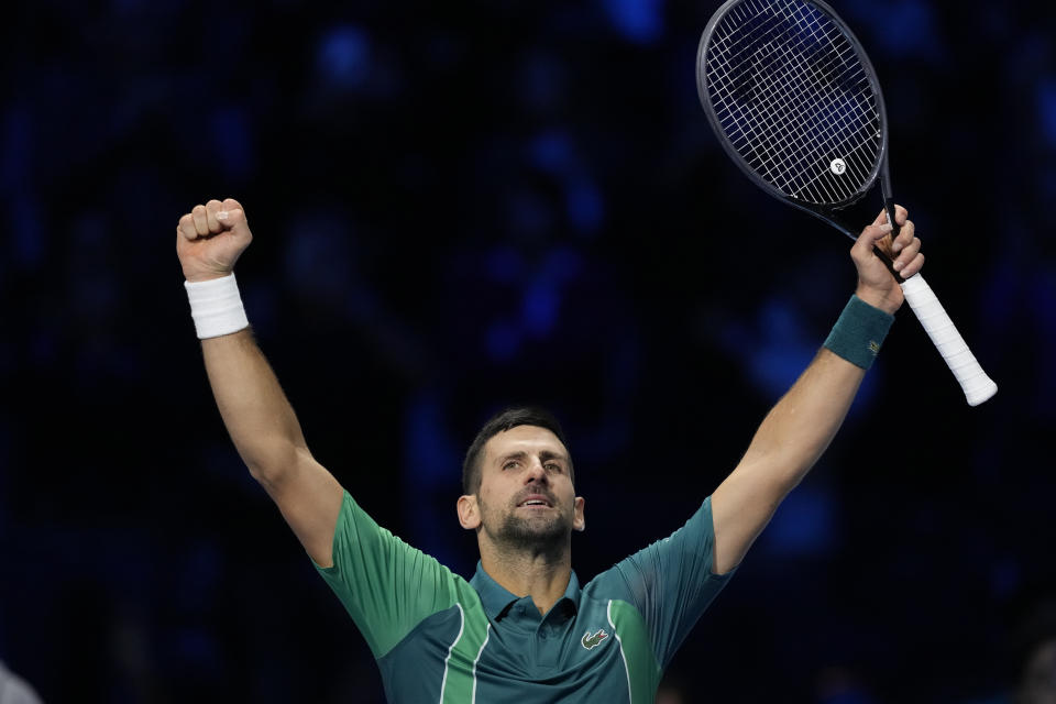 Serbia's Novak Djokovic celebrates after winning the singles tennis match against Denmark's Holger Rune, of the ATP World Tour Finals at the Pala Alpitour, in Turin, Italy, Monday, Nov. 13, 2023. (AP Photo/Antonio Calanni)