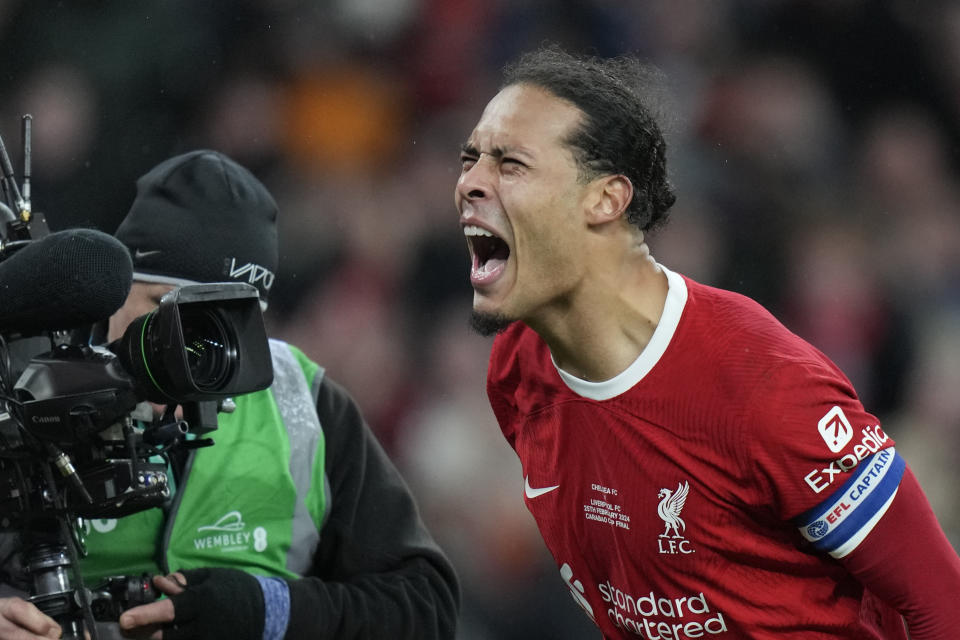 Liverpool's Virgil van Dijk celebrates after scoring his side's first goal during the English League Cup final soccer match between Chelsea and Liverpool at Wembley Stadium in London, Sunday, Feb. 25, 2024. (AP Photo/Alastair Grant)