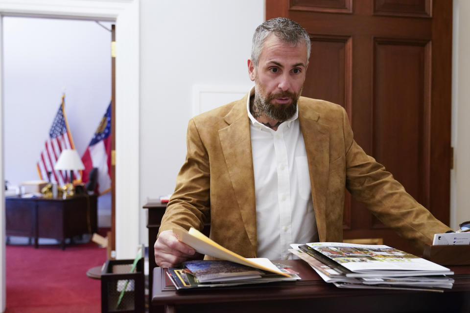 Former Washington Metropolitan Police Department officer Michael Fanone arrives to hand deliver a letter to Rep. Marjorie Taylor Greene's office as the House meets for a second day to elect a speaker and convene the 118th Congress in Washington, Wednesday, Jan. 4, 2023. (AP Photo/Jacquelyn Martin)