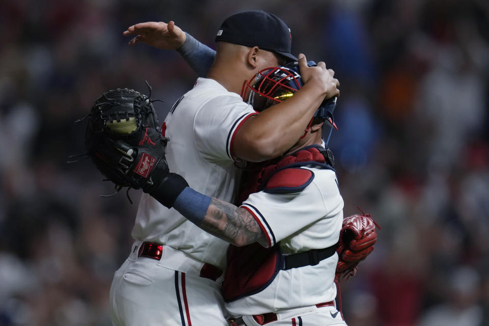 Minnesota Twins relief pitcher Jhoan Duran, left, and catcher Christian Vazquez celebrate after the team's 5-2 win in a baseball game against the New York Mets, Friday, Sept. 8, 2023, in Minneapolis. (AP Photo/Abbie Parr)