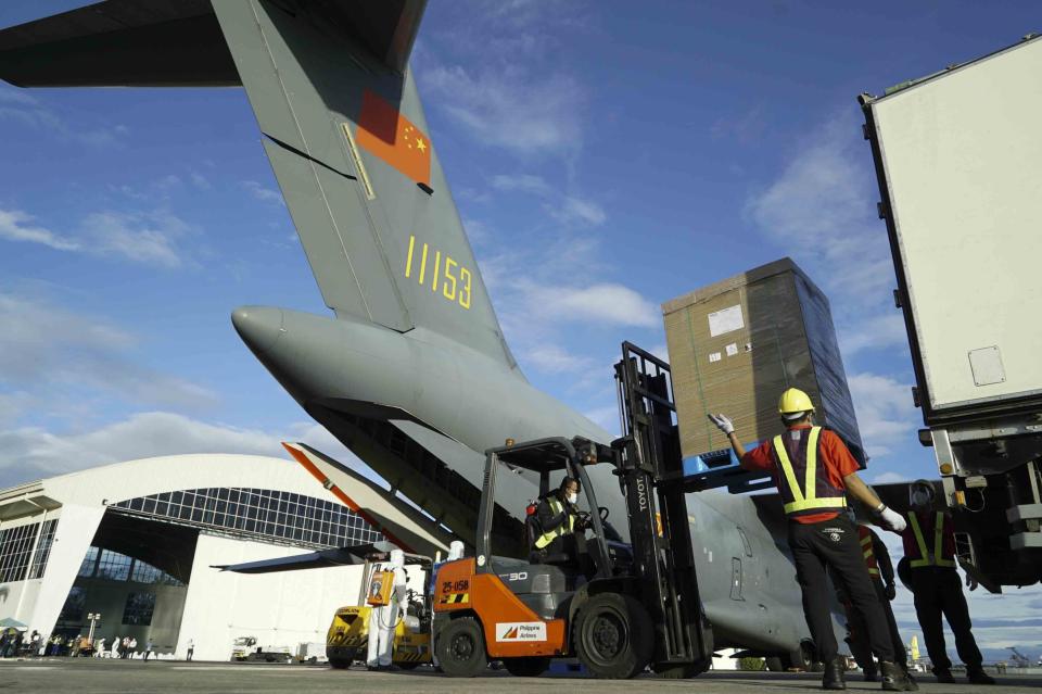 In this handout photo provided by the Malacanang Presidential Photographers Division, Boxes with Sinovac vaccines from China are transported as it arrives at the Villamor Air Base in Manila, Philippines on Sunday Feb. 28, 2021. The Philippines received its first batch of COVID-19 vaccine Sunday, among the last in Southeast Asia to secure the critical doses despite having the second-highest number of coronavirus infections and deaths in the hard-hit region. (King Rodriguez/ Malacanang Presidential Photographers Division via AP)