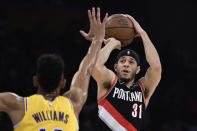 FILE - In this April 9, 2019, file photo, Portland Trail Blazers guard Seth Curry shoots as Los Angeles Lakers forward Johnathan Williams defends during the first half of an NBA basketball game in Los Angeles. Seth Curry is returning to Dallas as a free agent after a year away. Two people with knowledge of the deal say Stephen Curry's younger brother and the Mavericks have agreed on a $32 million, four-year contract. The people spoke to The Associated Press on condition of anonymity because deals can't be signed until Saturday. (AP Photo/Mark J. Terrill, File)