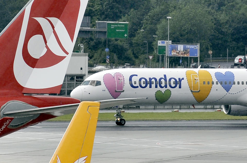 FILE - In this July 8, 2008 file photo, a Condor plane at the airport in Duesseldorf, Germany. The owner of Polish carrier LOT is taking over German airline Condor, a subsidiary of collapsed tour operator Thomas Cook, according to an announcement Friday Jan. 24, 2020. (AP Photo/Martin Meissner, FILE)