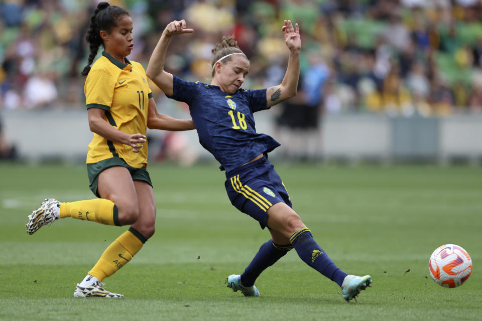 Sweden's Julia Zigiotti Olme, right, rashes for the ball in front of Australia's Mary Fowler during their women's friendly soccer match in Melbourne, Australia, Saturday, Nov. 12, 2022. (Asanka Brendon Ratnayake)