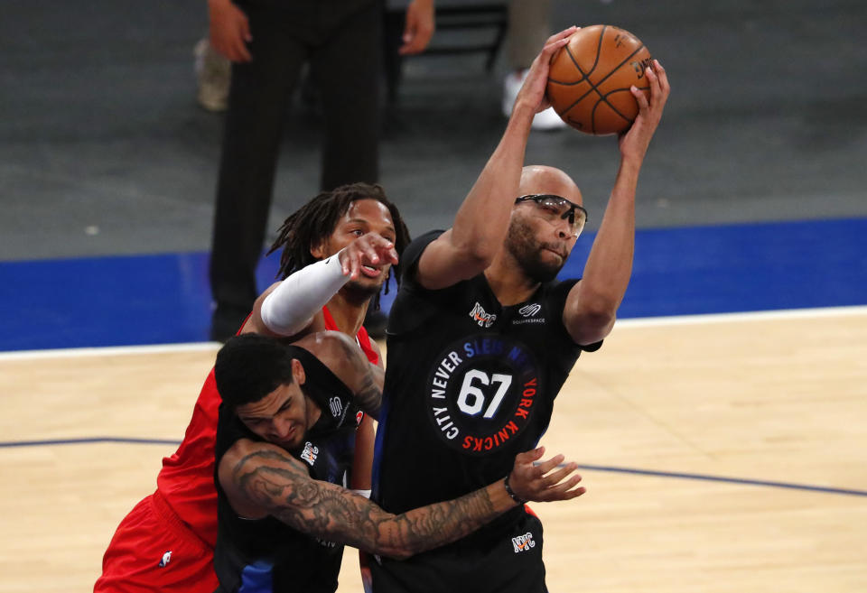 New York Knicks center Taj Gibson (67) grabs a rebound against Toronto Raptors forward Freddie Gillespie during the first half of an NBA basketball game Saturday, April 24,2021, in New York. (AP Photo/Noah K. Murray)