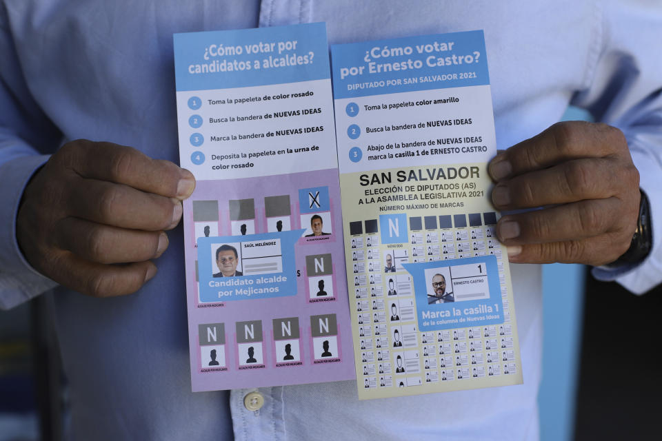 Former guerrilla fighter Saul Melendez holds a couple of flyers with information on how to vote for the New Ideas party, in Mejicanos, a district of San Salvador, El Salvador, Sunday, April 4, 2021. Melendez's recent electoral victory makes Mejicanos one of the 152 city halls that will be in the hands of New Ideas on May 1 out of a total of 262 in the country. (AP Photo/Salvador Melendez)