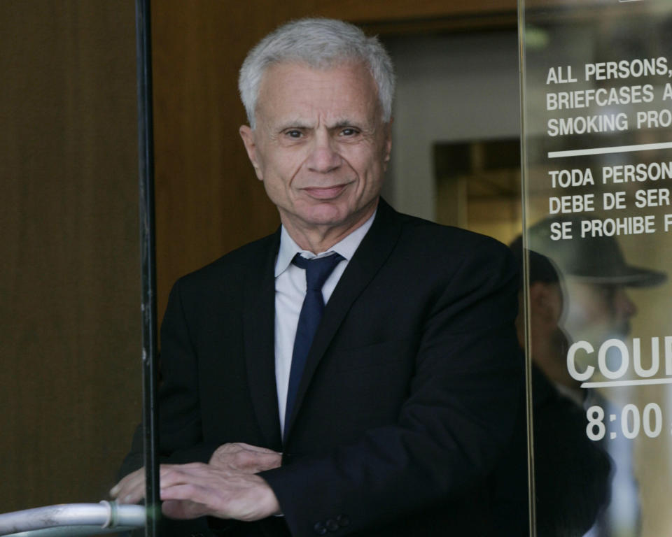 FILE - Actor Robert Blake leaves court for the lunch break, Oct. 3, 2005, after his second day of testimony in a wrongful death lawsuit, brought by the family of Bonny Lee Bakley, in Burbank, Calif. Blake, the Emmy award-winning performer who went from acclaim for his acting to notoriety when he was tried and acquitted of murdering his wife, died Thursday, March 9, 2023, at age 89. (AP Photo/Nick Ut, File)