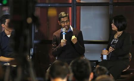 Google CEO Sundar Pichai (C) gestures as he addresses a conference with Vietnamese IT community in Hanoi, Vietnam December 22, 2015. REUTERS/Kham