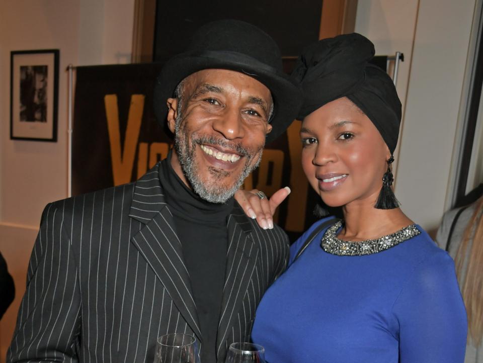 Danny John-Jules and Petula Langlais dressed up and holding wine at the inaugural Visionary Honours Awards in 2019