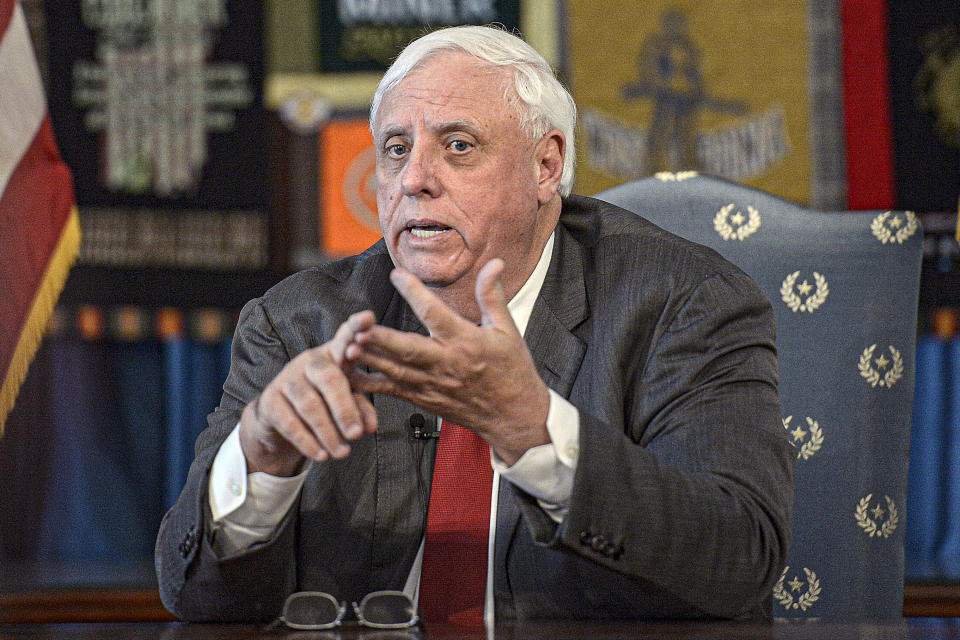 FILE - In this March 12, 2020, file photo, West Virginia Gov. Jim Justice speaks during a press conference at the State Capitol in Charleston, W.Va. Justice’s family companies received at least $6.3 million from a federal rescue package meant to keep small businesses afloat during the coronavirus pandemic. According to data released by the Treasury Department on Monday, July 6 at least six Justice family businesses received the Paycheck Protection Program loans. (F. Brian Ferguson/Charleston Gazette-Mail via AP, File)