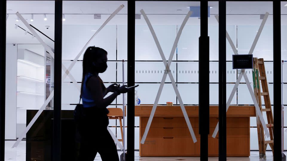 Windows are taped in anticipation of Typhoon Saola at a store in Hong Kong on August 31. - Tyrone Siu/Reuters