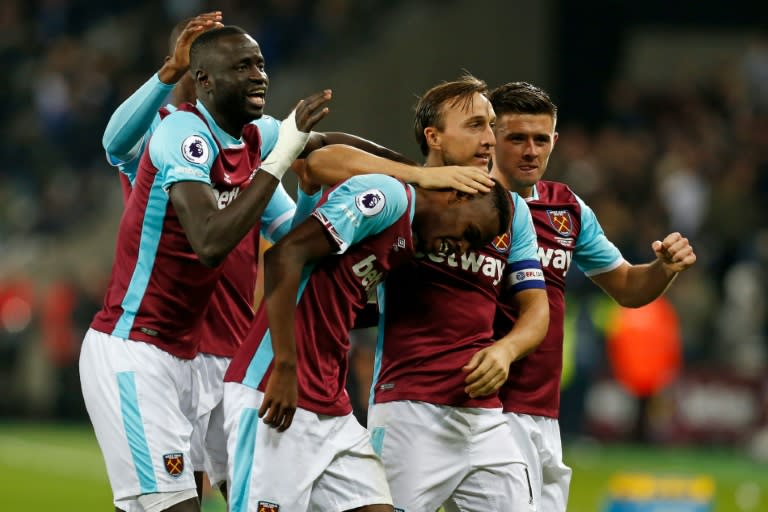 West Ham United's Swiss midfielder Edimilson Fernandes (C) celebrates with teammates after scoring their second goal against Chelsea in east London on October 26, 2016