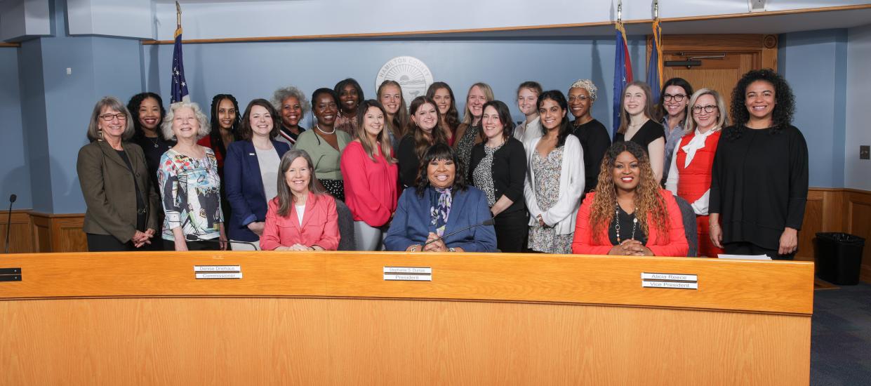 Hamilton County commissioners Denise Driehaus (front left), Stephanie Summerow Dumas (front center) and Alicia Reece (front right) are with members of the Hamilton County Commission on Women & Girls.