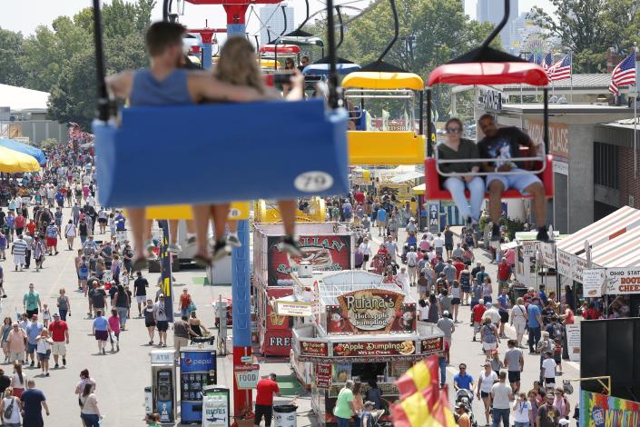 The Sky Glider floats over the WNCI Food Highway at the Ohio State Fair in Columbus in 2019. In the wake of recent mass shootings across the U.S., security will be increased this summer for the popular event, which opens next Wednesday and will last until Aug. 7