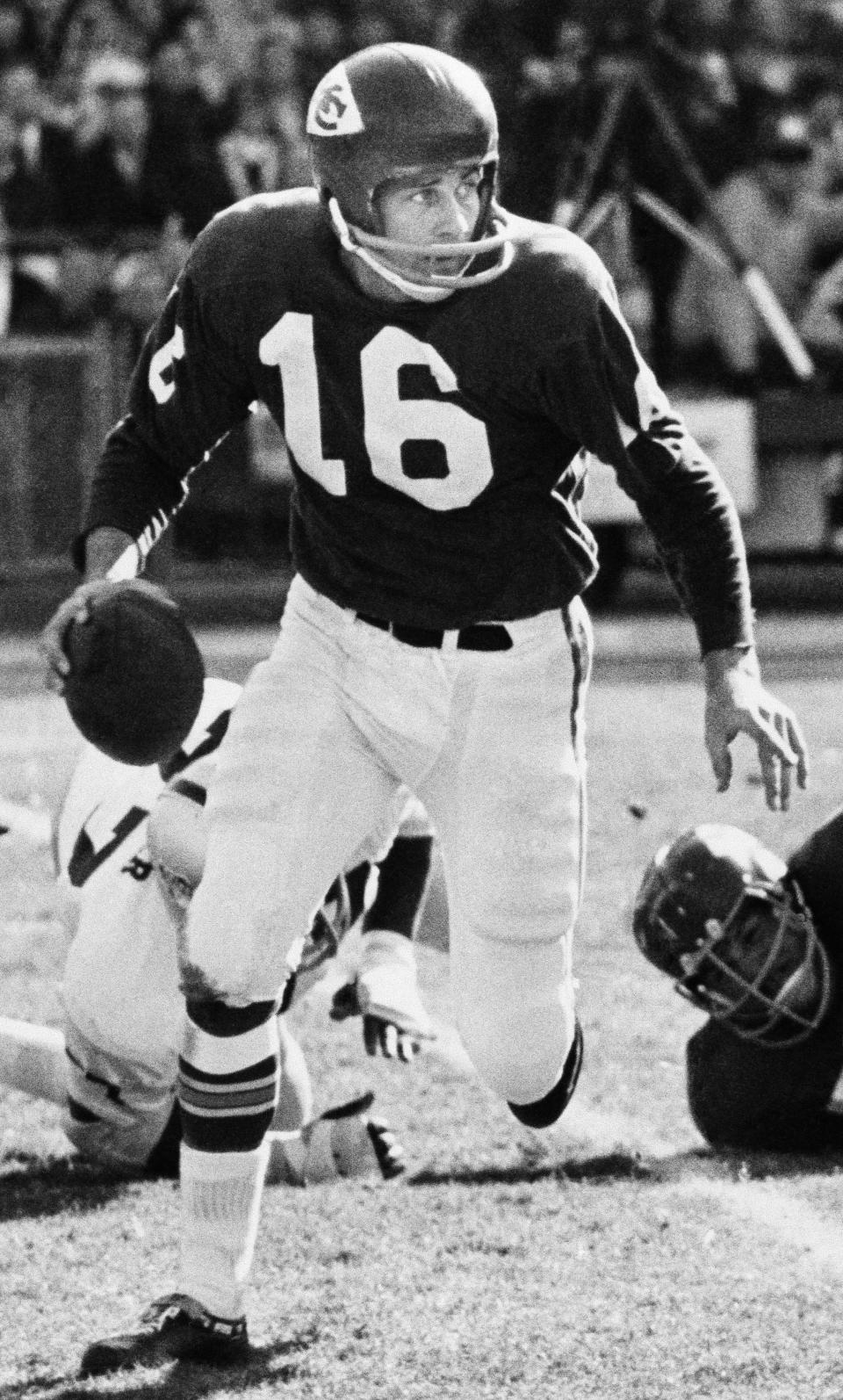 FILE - Len Dawson, Kansas City Chiefs quarterback, is pictured getting ready to throw a pass, Nov. 18, 1966, in Kansas City, Mo. Hall of Fame quarterback Len Dawson, who helped the Kansas City Chiefs to a Super Bowl title, died Wednesday, Aug. 24, 2022. He was 87. (AP Photo/William P. Straeter, File)