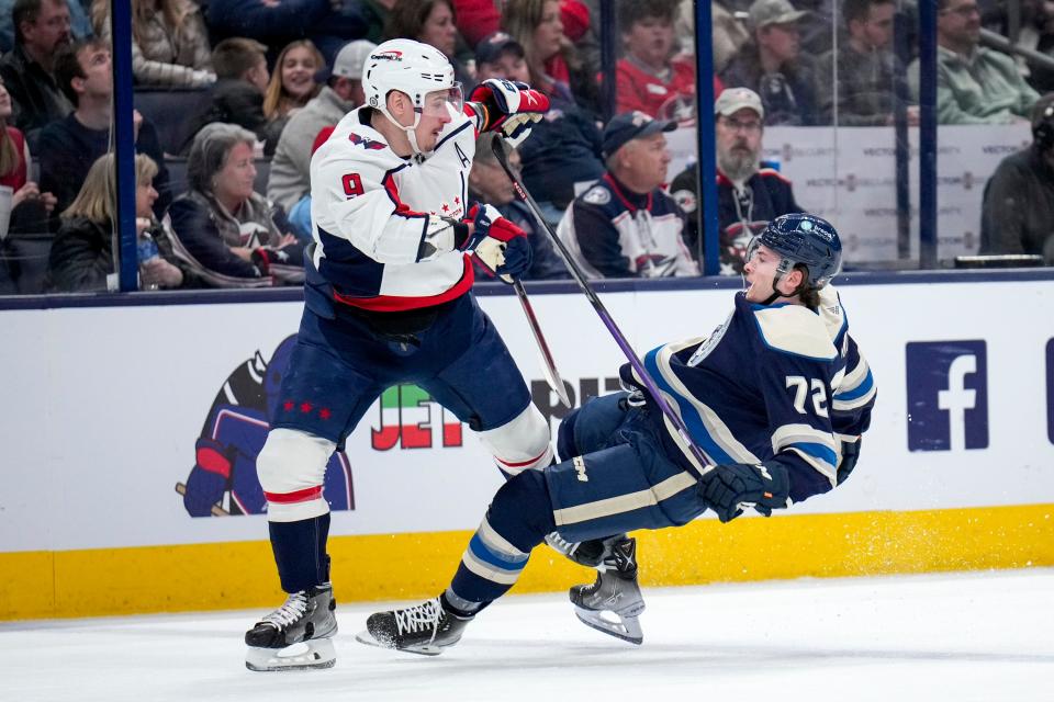 Jan 5, 2023; Columbus, Ohio, USA;  Columbus Blue Jackets right wing Carson Meyer (72) collides with Washington Capitals defenseman Dmitry Orlov (9) during the first period of the NHL game between the Columbus Blue Jackets and the Washington Capitals on Thursday night at Nationwide Arena. Mandatory Credit: Joseph Scheller-The Columbus Dispatch