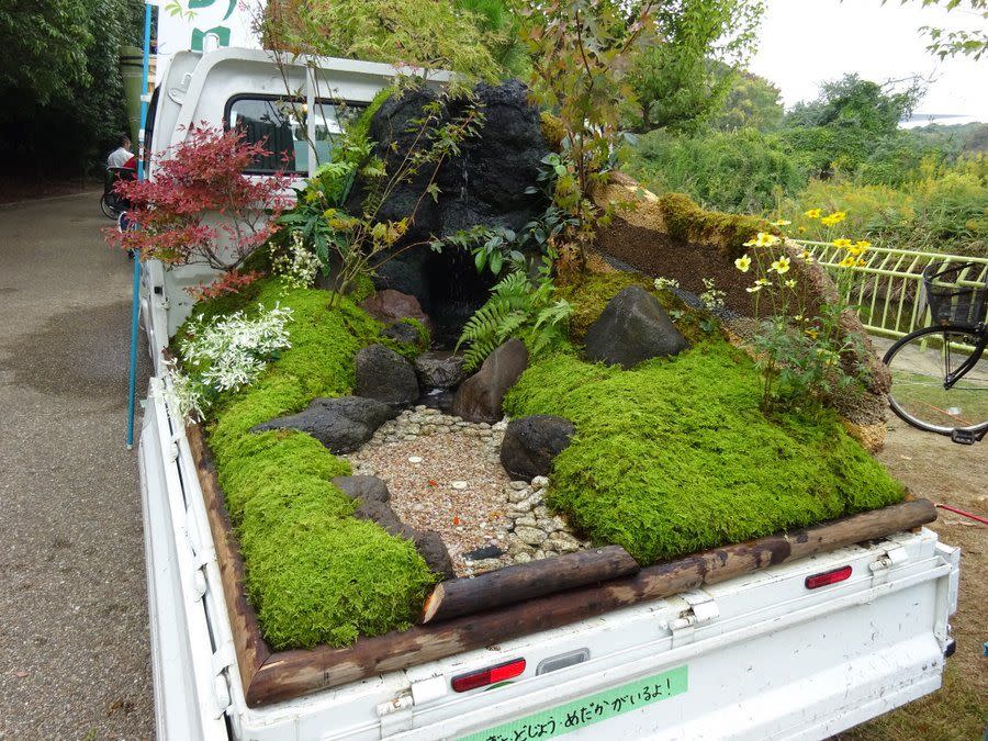 a truck with plants and rocks