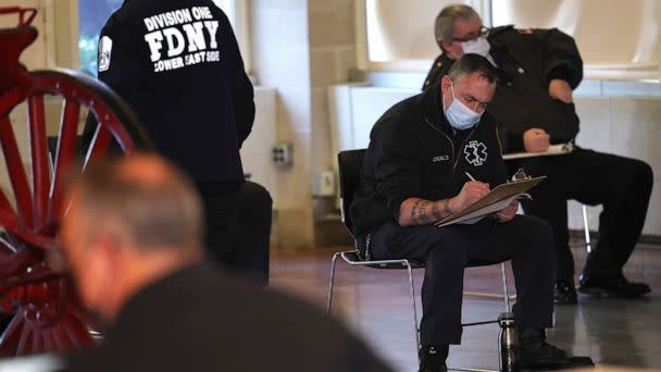 PHOTO: In this Dec. 23, 2020 file photo members of the Fire Department of New York Emergency Medical Services fill out forms as they prepare to receive their coronavirus vaccine in New York. (Michael M. Santiago/Getty Images, FILE)