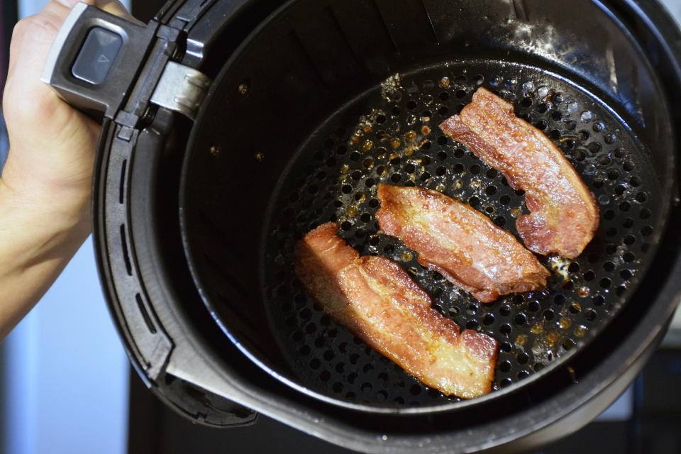 Cooking bacon in your air fryer reduces the amount of grease you consume. (Vidya Rao)