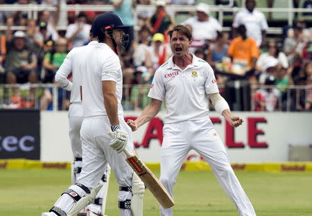 South Africa's Dale Steyn celebrates the wicket of England's Alistair Cook (L) during their first cricket test match in Durban, South Africa, December 26, 2015. REUTERS/Rogan Ward