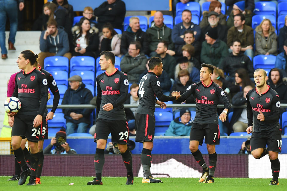 Alexis Sanchez of Arsenal celebrates scoring his sides fifth goal during with his Arsenal team mates the Premier League match between Everton and Arsenal at Goodison Park on October 22, 2017 in Liverpool, England.