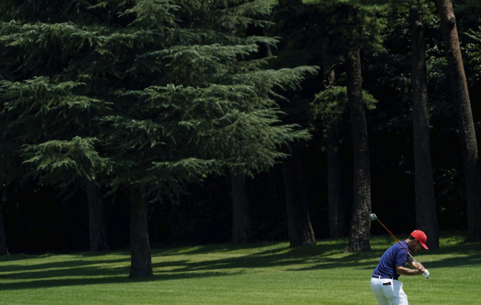 CORRECTS LAST NAME TO SCHAUFFELE FROM SHAUFFELE - Xander Schauffele of the United States plays a shot from the 5th fairway during the final round of the men's golf event at the 2020 Summer Olympics on Sunday, Aug. 1, 2021, in Kawagoe, Japan. (AP Photo/Matt York)