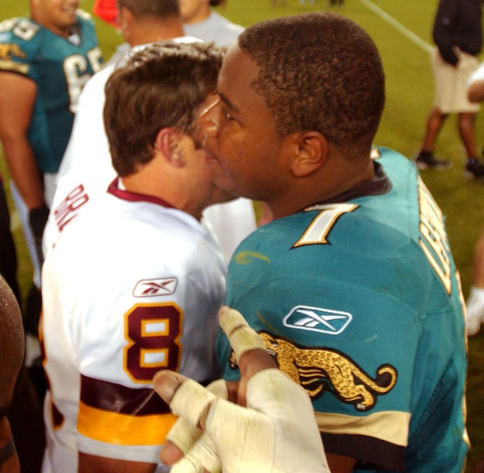 Former Jaguars quarterback Mark Brunell (left) hugs 2006 Jags starter Byron Leftwich (right) after Brunell threw the winning touchdown pass in overtime in 2006 to beat the Jags 36-30.