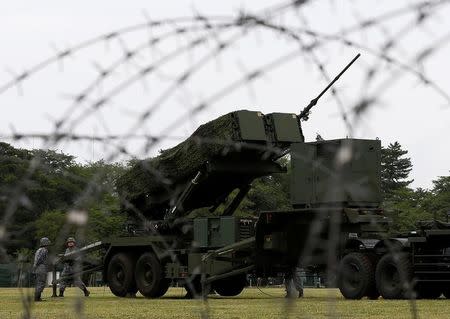 Japan Self-Defense Forces (JSDF) soldiers hold a drill to mobilise their Patriot Advanced Capability-3 (PAC-3) missile unit in response to recent missiles launch by North Korea, at JSDF Asaka base in Asaka, north of Tokyo, Japan, June 21, 2017. REUTERS/Issei Kato