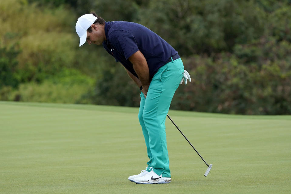 Patrick Reed reacts to missing his birdie putt on the 18th green during second round of the Tournament of Champions golf event, Friday, Jan. 3, 2020, at Kapalua Plantation Course in Kapalua, Hawaii. (AP Photo/Matt York)