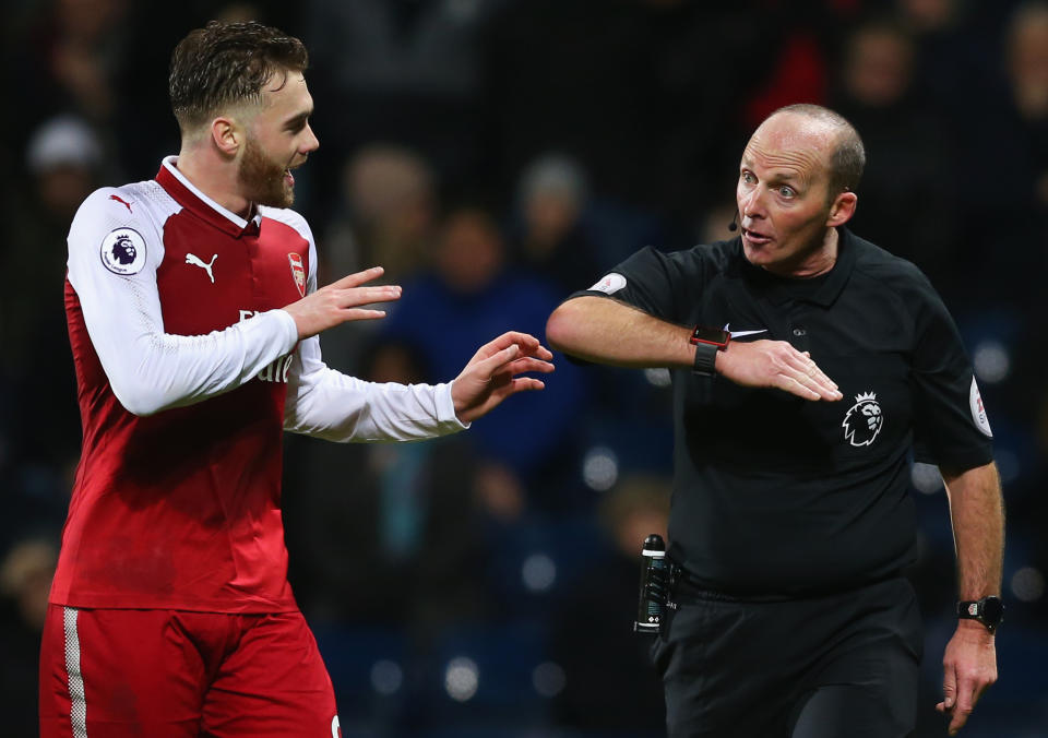 Calum Chambers argues with referee Mike Dean about the penalty decision that cost Arsenal at West Brom. (Getty)