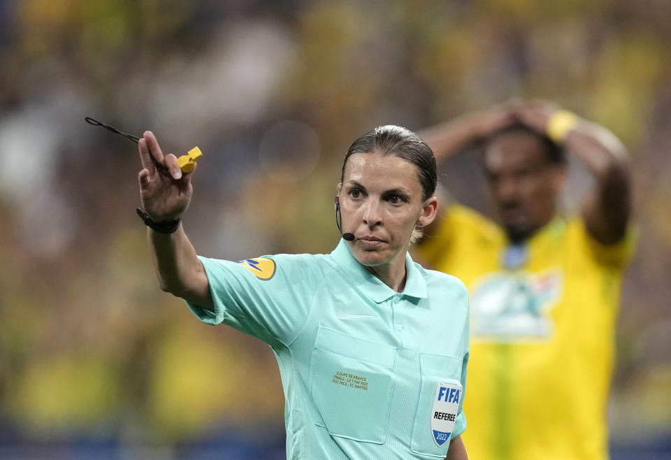 Referee Stephanie Frappart gives directions during the French Cup final soccer match between Nice and Nantes at the Stade de France stadium, in Saint Denis, north of Paris, Saturday, May 7, 2022. (AP Photo/Christophe Ena)