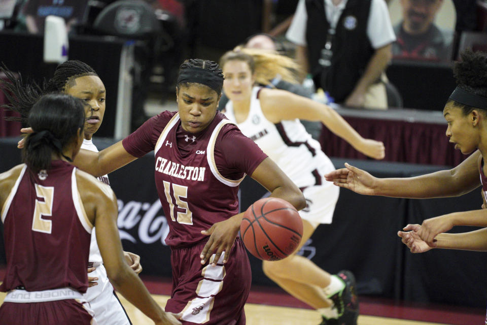 Charleston forward Arynn Eady (15) battles for a loose ball against South Carolina guard Eniya Russell, left, during the first half of an NCAA college basketball game Wednesday, Nov. 25, 2020, in Columbia, S.C. (AP Photo/Sean Rayford)