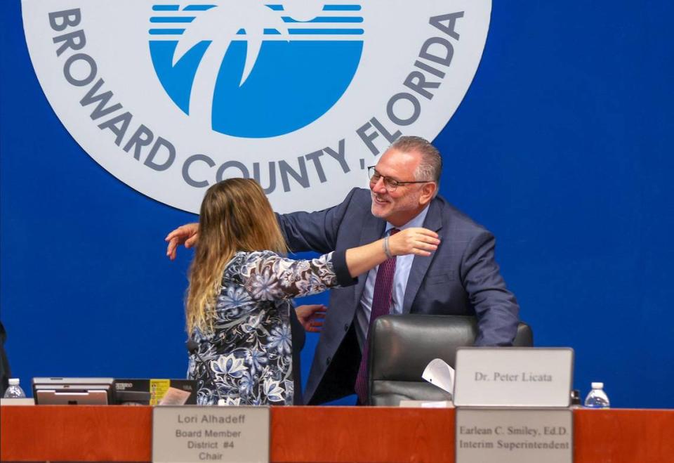 Board School Board Chair Lori Alhadeff, left, embraces the new Broward Schools Superintendent Peter Licata, as he prepares to take his seat among Broward School Board members after the board on Tuesday, July 11, 2023, unanimously approved a three-year contract for Licata, agreeing to pay him an annual salary of $350,000.