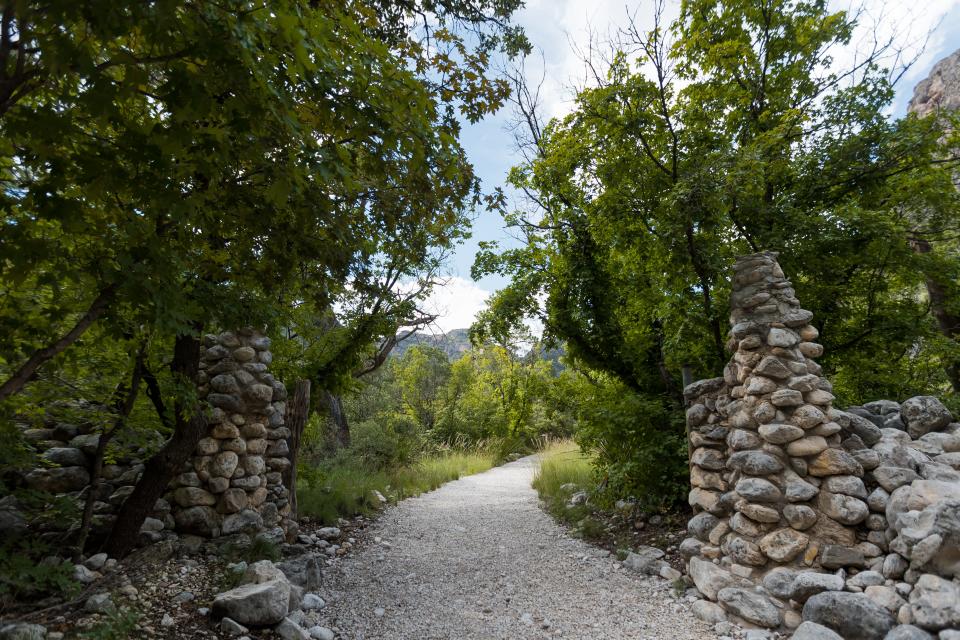 Stacked stones line the entrance leading up to the Wallace Pratt Lodge in McKittrick Canyon at Guadalupe Mountains National Park.