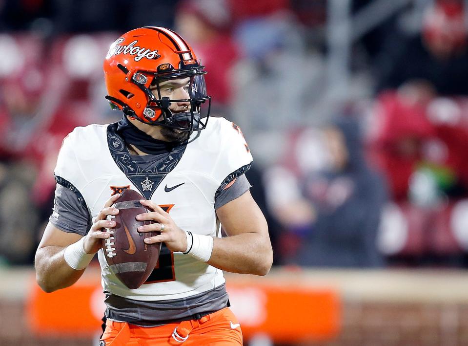 Nov 19, 2022; Norman, Oklahoma, USA; Oklahoma State's Spencer Sanders (3) warms up before the Bedlam college football game between the University of Oklahoma Sooners (OU) and the Oklahoma State University Cowboys (OSU) at Gaylord Family-Oklahoma Memorial Stadium. Mandatory Credit: Sarah Phipps-USA TODAY Sports