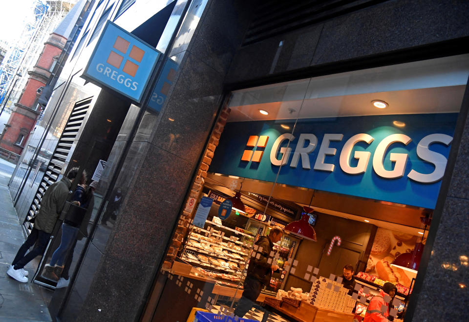 FILE PHOTO: Customers enter a branch of Greggs bakery chain in London, Britain, January 5, 2022. REUTERS/Toby Melville/File Photo