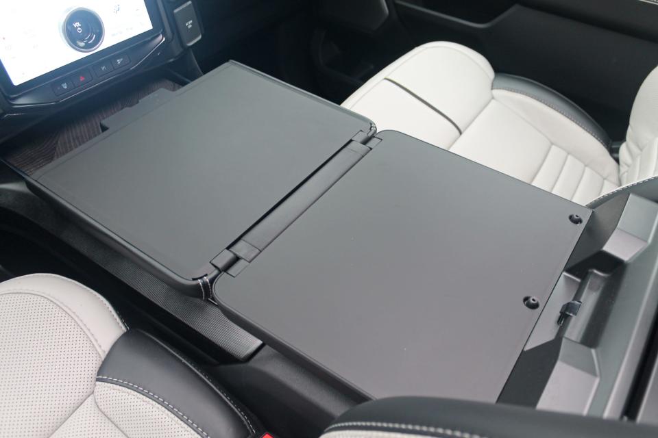 The 2023 Ford F-150 Lightning Platinum's folding work surface feature.