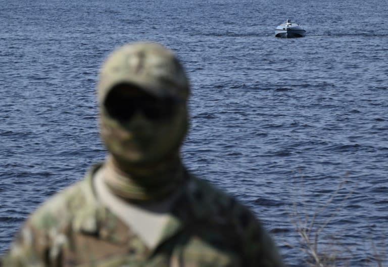 A Ukrainian soldier demonstrates a naval drone (Genya SAVILOV)