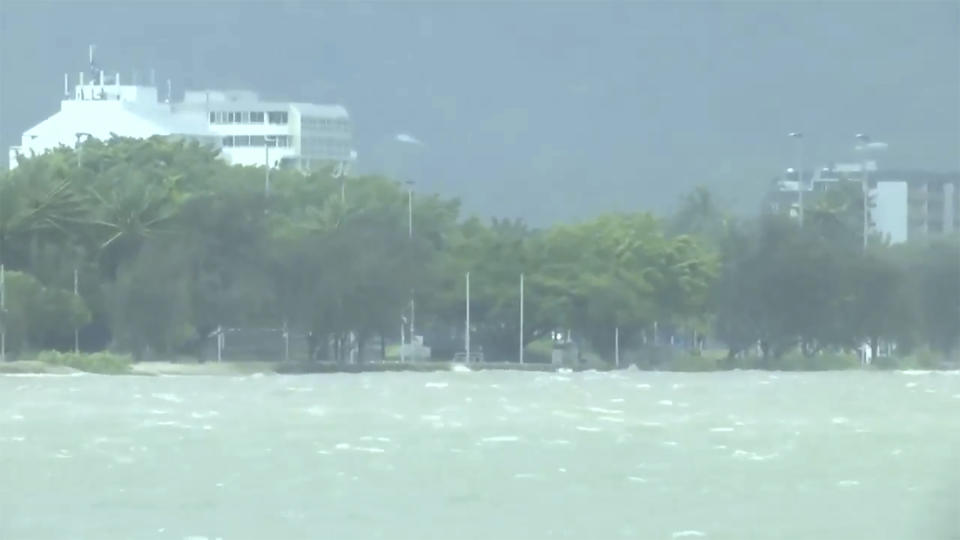 This image made from video show heavy seas in Cairns, Australia Wednesday, Dec. 13, 2023. Powerful winds began uprooting trees on the northeast Australian coast on Wednesday as Tropical Cyclone Jasper gathered strength while approaching the area. (Australian Broadcasting Corporation via AP)