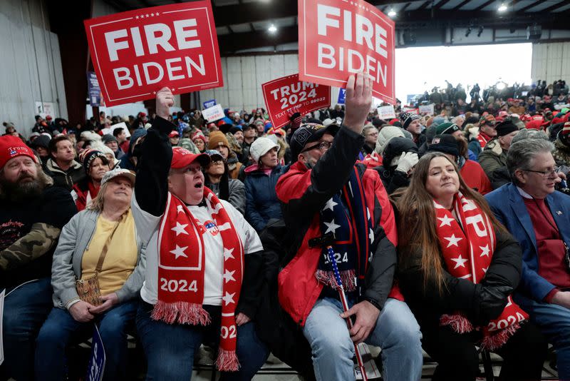 FILE PHOTO: Supporters attend a campaign rally for former U.S. President Donald Trump in Waterford Township, Michigan