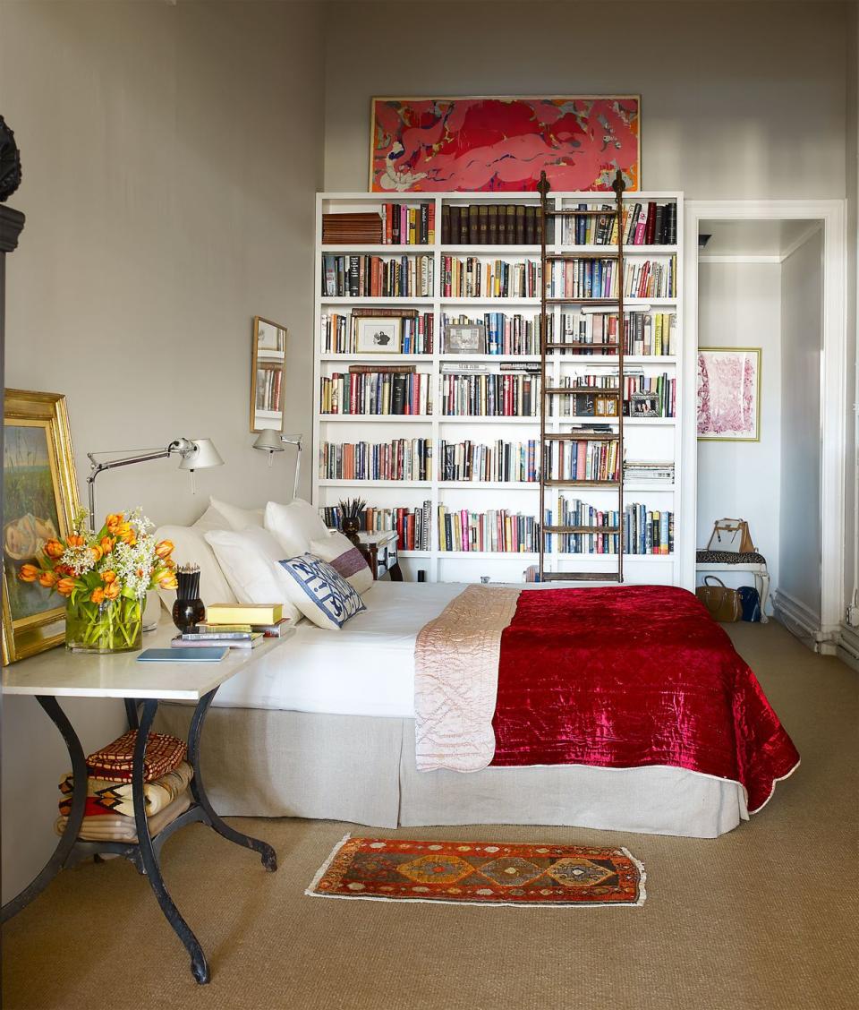 boho bedroom with custom bookcase and english library ladder