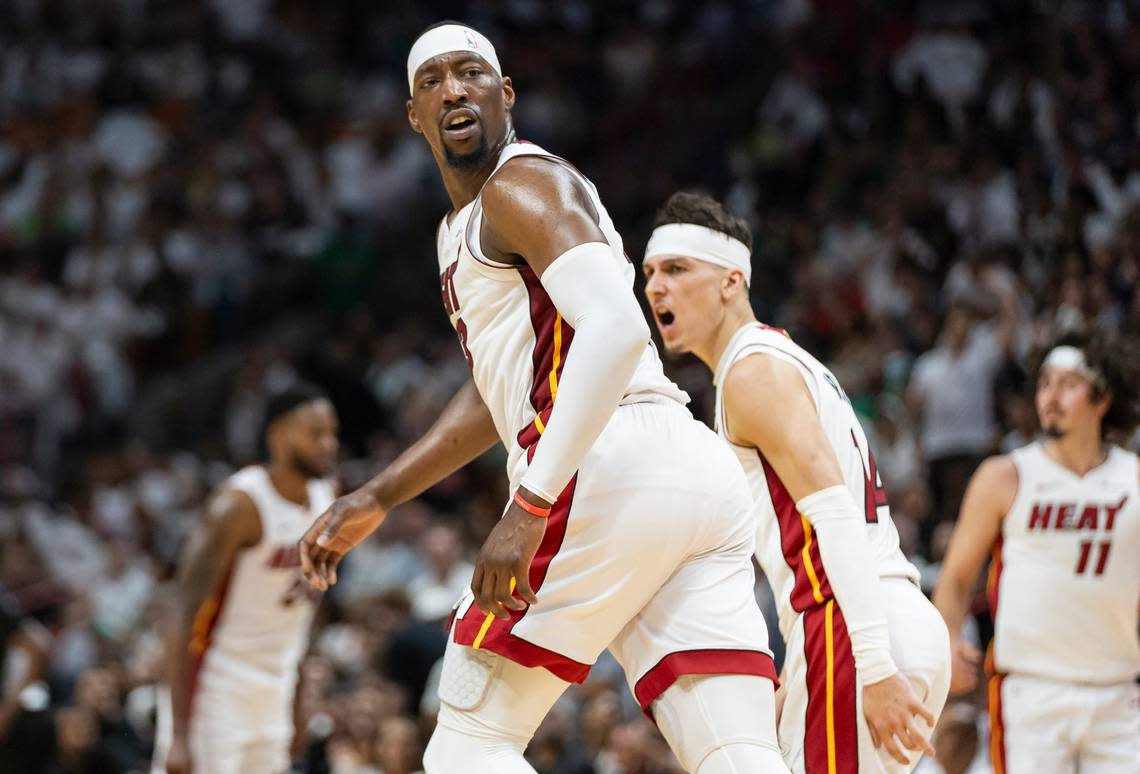Miami Heat center Bam Adebayo (13) reacts after scoring against the Boston Celtics in the first half of Game 4 of an NBA basketball first-round playoff series at Kaseya Center on Monday, April 29, 2024, in Miami.