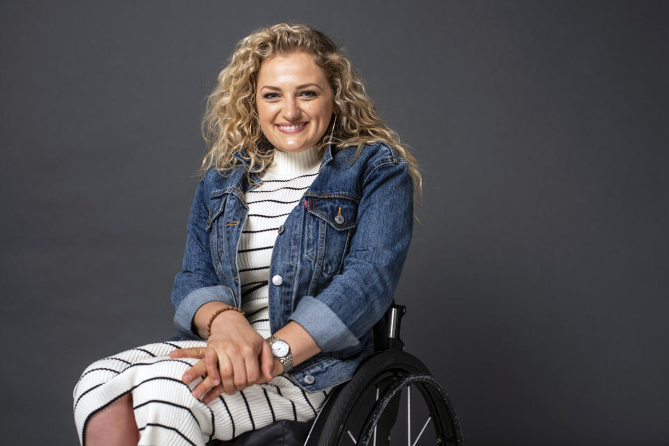 In this Thursday, May 30, 2019, photo, Ali Stroker poses for a portrait in New York. Stroker is on the cusp of musical theater history. At the upcoming Tony Awards, she could become the first person in a wheelchair to win a Tony. (Photo by Scott Gries/Invision/AP)