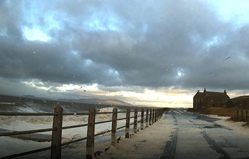 Footage shows the waves lapping over the road. (SWNS)