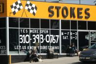 People wait outside a newly-reopened tire store, as the global outbreak of the coronavirus disease (COVID-19) continues, in Santa Monica