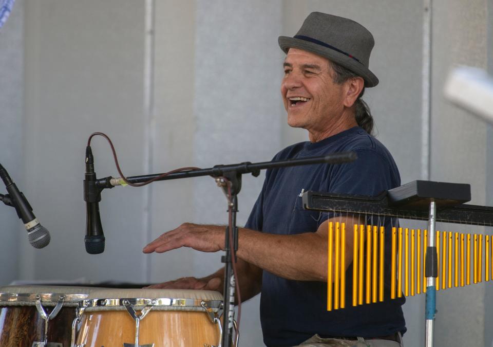 Carlos Lopez plays the congas with the Tropical Nights latin jazz band that performed in the second show of the annual Concerts in the Park series at Victory Park in Stockton on July, 21, 2021. 