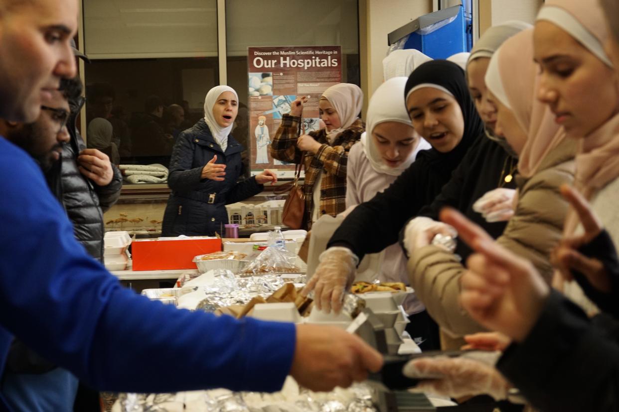 Volunteers sell goods Friday at a bake sale for Syrian and Turkish earthquake victims at the Noor Islamic Cultural Center in Hilliard.